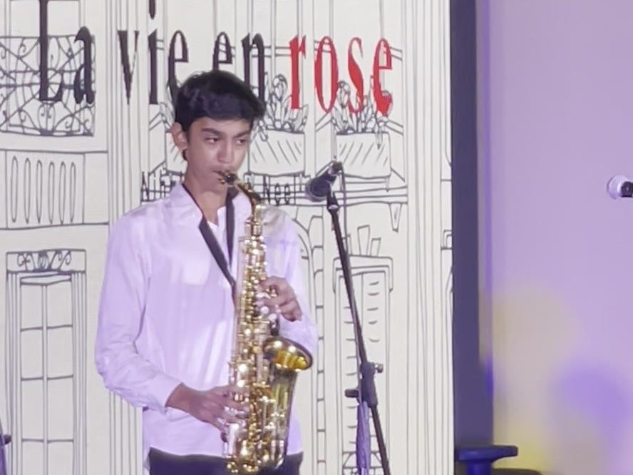 Performing ‘La Vie en Rose’ on saxophone at the school annual concert